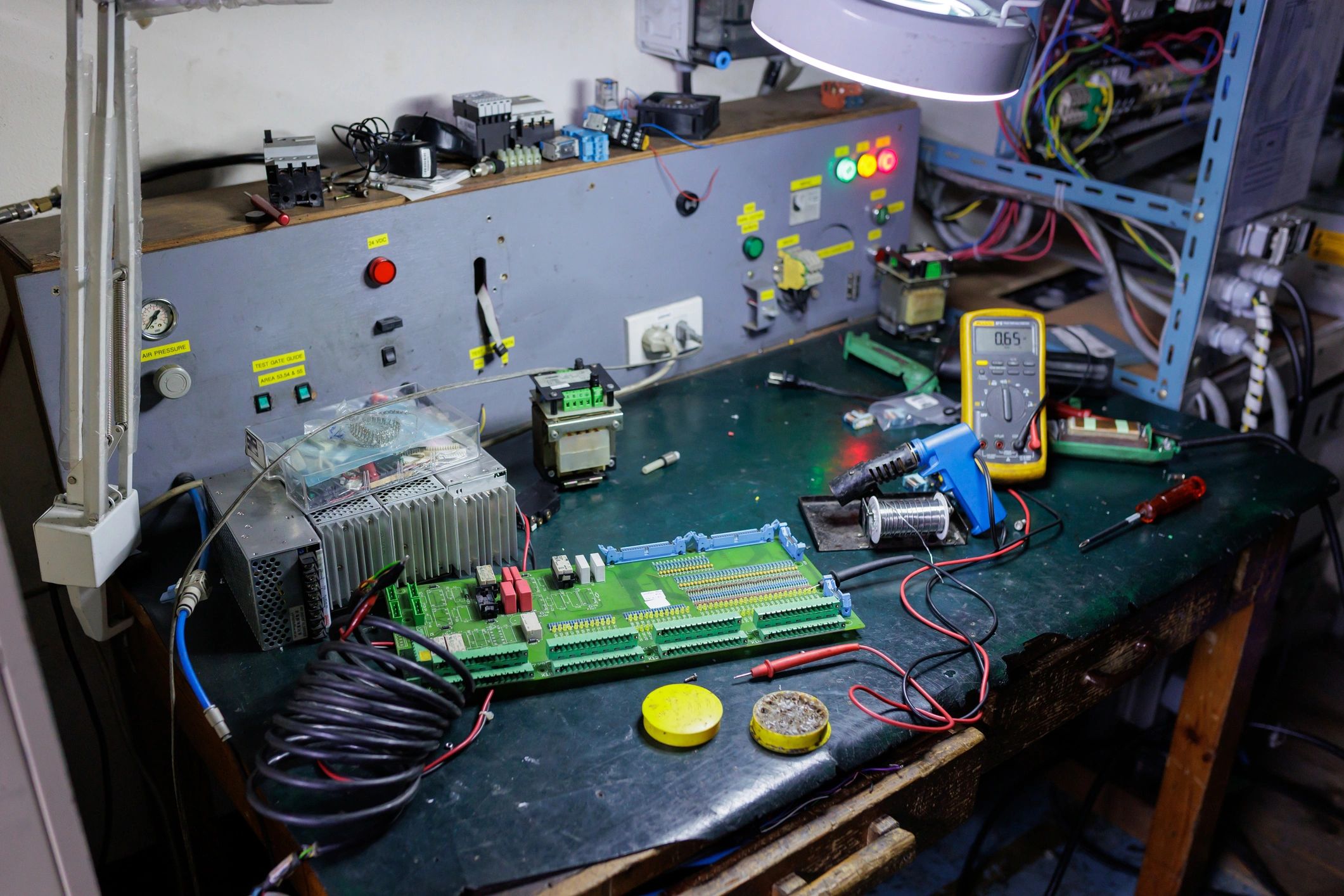 Electronics components and tools on a technical workbench