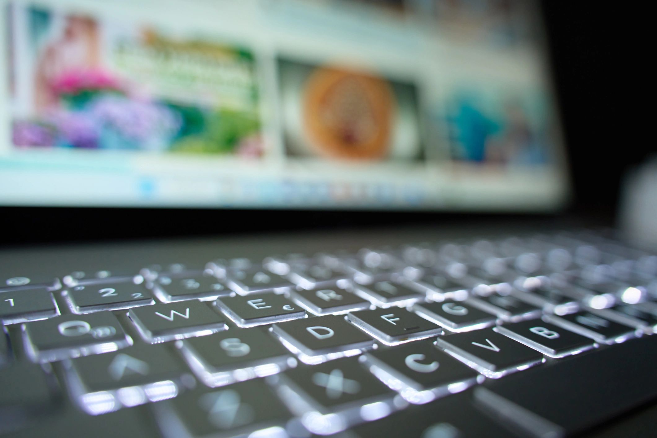 Close-up of laptop keyboard and screen for laptop review research